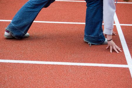 ready for a sprint on an athletic track