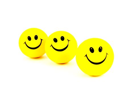 yellow smiley face on a white backgroundの写真素材