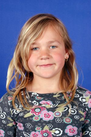 portrait of cute blond girl on blue background