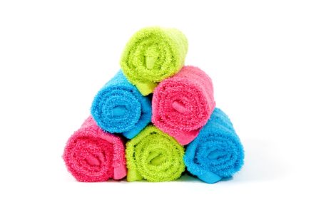 Colorful towel rolls on a white backgroundの写真素材