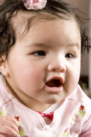 four months old baby over white