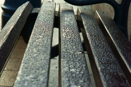raindrops on a bench, wet wooden boardsの写真素材