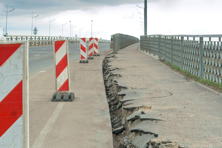 repair broken sidewalk pavement cracksの写真素材