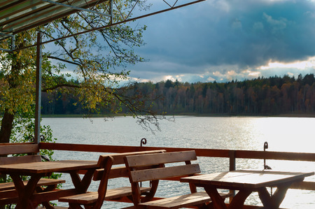 summer dining outside the city, summer cafe in the woods at the lakeの写真素材