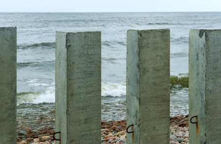 piles on the sea, the construction of the sea coast fortifications, the construction of the boardwalk by the seaの写真素材