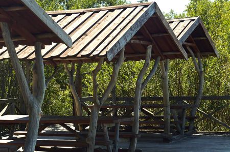 pavilion wooden handmade tables and benches made of wood, wooden summer cafeの写真素材