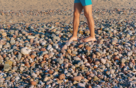 walk on stones, walk on sea stones, sea stones and feetの写真素材