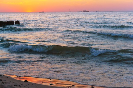 pink and purple sky and water at sunset, sea sunset, sunrise on the Baltic sea