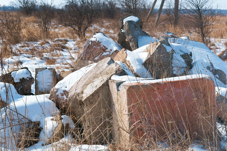 The wreckage of concrete slabs in nature, construction waste in the fieldの写真素材