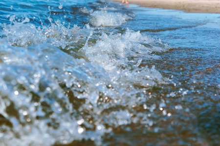 sea water foam, sea wave, the excitement on the shore sea, the water is boilingの写真素材