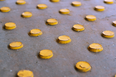 Yellow buttons on a gray background, yellow circles arranged in rows