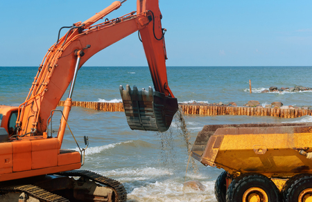 construction equipment on the shore, the construction of breakwaters, coastal protection measuresの写真素材