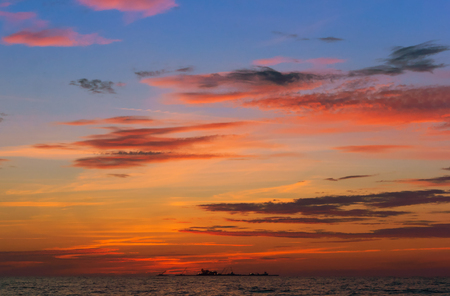 sunset on the sea, sunrise in the waves of the seaの写真素材