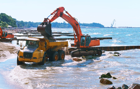 construction equipment on the shore, the construction of breakwaters, coastal protection measuresの写真素材