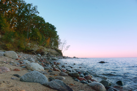 sunrise on the sea coast, sunset on the rocky seashoreの写真素材
