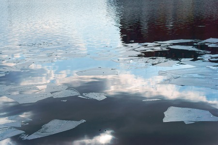reflection of the sun and clouds from the ice, floating iceの写真素材