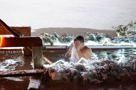 Epiphany bathing in the hole, The Baptism Of The Lord Epiphany, Konstantinovka village, Kaliningrad region, Russia, January 18, 2019のeditorial素材