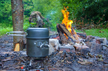 cooking tea over a fire, cooking on a hikeの写真素材