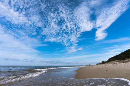 beautiful blue sky over the sea, seascape and wavesの写真素材