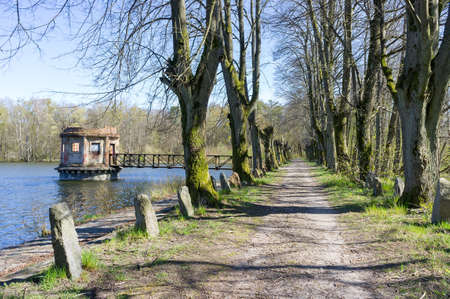 turret with a shutter on a forest pond, an old abandoned structure on a pond, vilgeiten pond, kolosovka village, Zelenograd city district, Kaliningrad region, Russia, August 18, 2019のeditorial素材