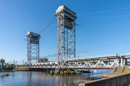 Two-tier bridge across the river, the lower tier of the bridge - automobile traffic, on the upper - railway, Russia, Kaliningrad, August 16, 2020のeditorial素材