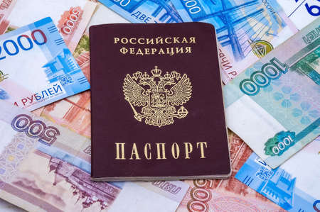 Russian paper money, Russian passport and rubles, two thousand rubles, five thousand rubles, one thousand rublesのeditorial素材