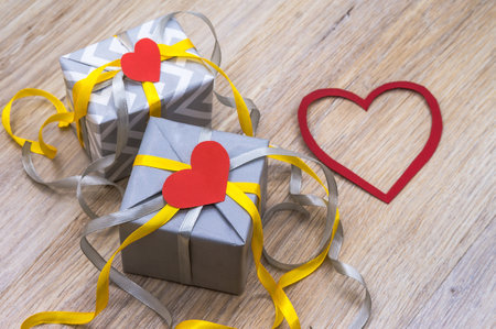 valentine's day february 14, gray gift with yellow ribbon, valentine's day decorの写真素材