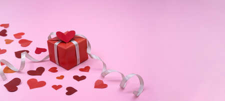 rose background, gift packaging, gray ribbon wrapped gift, holiday gift, valentine's day February 14の写真素材