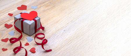 give a gift, gray gift box with red ribbon, valentine's day february 14, birthday gift, valentine's day decorの写真素材