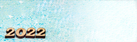Banner 2022. Figures 2022 on blue background. Wooden figures on blue background. New Year's...