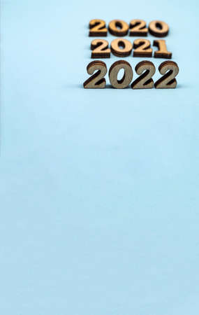 Banner 2022. Figures 2022 on blue background. Wooden figures on blue background. New Year's...
