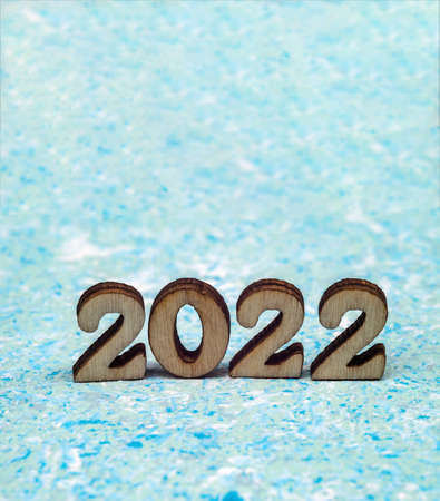 Banner 2022. Figures 2022 on blue background. Wooden figures on blue background. New Year's calendar.の写真素材