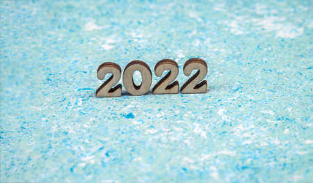 Banner 2022. Numerals 2022 on blue background. Wooden digits 2022.の写真素材