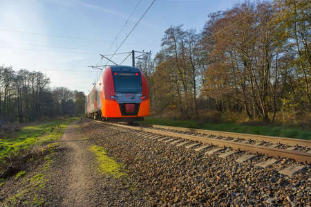 Kaliningrad region, Russia, November 17, 2019. An electric train on the railway tracks. Train rides...