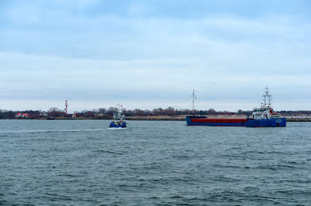 Kaliningrad Region, Russia, February 3, 2019. Angling vessel. A fishing vessel enters the harbor. The blue ship is going into port.のeditorial素材