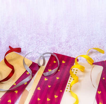 Postcard with the Holiday. Background for the card. Hearts and ribbons on pink.の写真素材