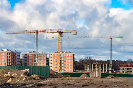Kaliningrad region, Russia, November 29, 2020. Construction of multi-storey houses. Construction cranes and houses. Construction of an apartment block.のeditorial素材