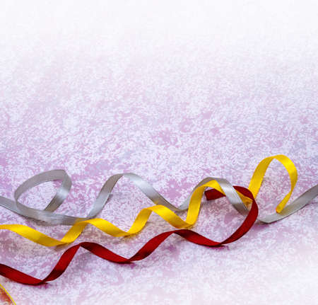 Ribbons on pink. Background for the card. Postcard with the Holiday.