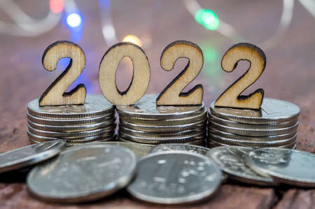 Coins and Figures 2022. Banner 2022. Money stacked in columns.の写真素材