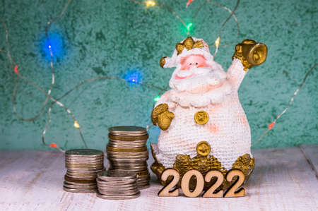 New Year's Santa Claus 2022. Money for the holiday. Holiday New Year and Christmas.の写真素材