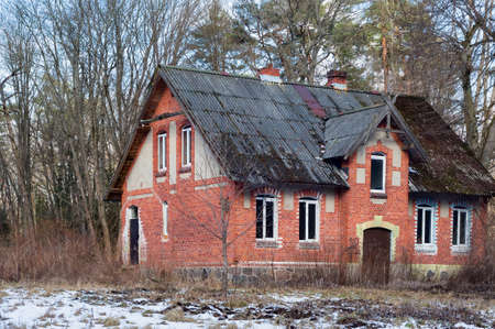 House of red brick. A lonely house in the woods. Kaliningrad region, Russia, March 6, 2021.のeditorial素材