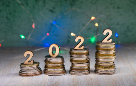 Coins and Figures 2022. Banner 2022. Money stacked in columns.の写真素材
