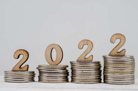 Coins and Figures 2022. Banner 2022. Money stacked in columns.の写真素材