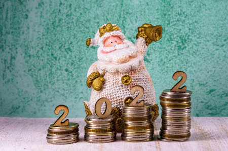 New Year's Santa Claus 2022. Money for the holiday. Holiday New Year and Christmas.の写真素材