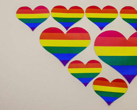 A heart cut out of paper. LGBT rainbow hearts pattern. Rainbow of LGBT colors.