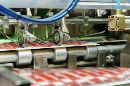 Printing house. Printing equipment. Machine for varnishing printed products. Processing after offset...