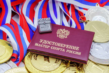 Kaliningrad, Russia, December 12, 2020. Badge sporting title master of sports. Document Master of Sports of Russia.のeditorial素材