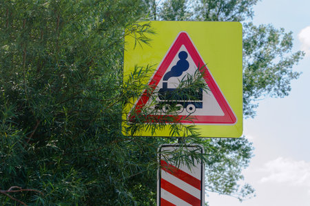 Warning sign before the railway crossing. The road sign of the railway crossing. Attention motorists.の写真素材