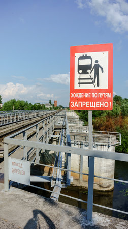 Kaliningrad region, Russia, June 26, 2023. A freight train passes over the bridge. Wagons of the freight train on the bridge.のeditorial素材