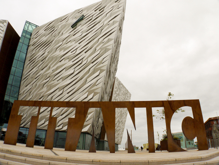 Belfast, Northern Ireland - September 01, 2014: Titanic sign located in front of the Titanic Museum in Belfast, Northern Ireland on a cloudy day. The Titanic Museum opened on March 31, 2012.のeditorial素材